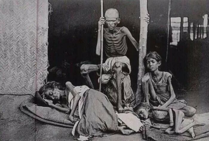 fascinating photos from history - A Man Guards His Family From The Cannibals During The Madras Famine Of 1877 At The Time Of British Raj, India