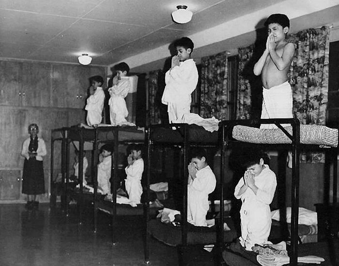 fascinating photos from history - Indigenous Children Forced To Pray To God In A Residential School Ran By The Canadian Government And Catholic Church Between 1930 And 1970, Unknown Location