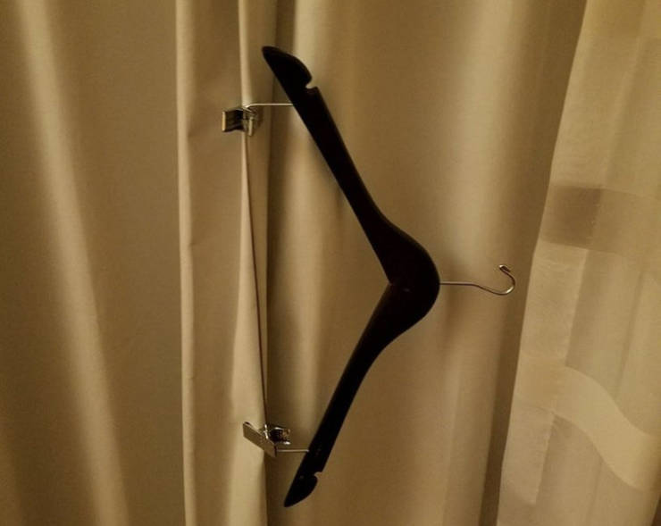 "A tip from a traveler. This is how you can keep the hotel curtains closed without letting any light in."