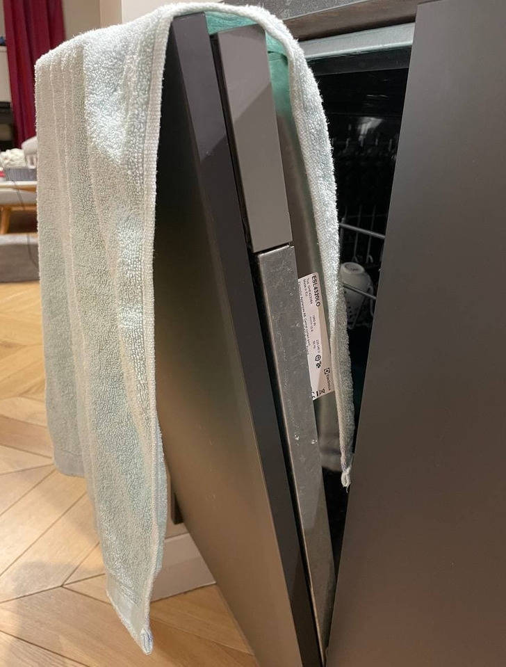 "If your dishwasher has finished its cycle but your dishes are still wet, use a towel." "Hang a towel on the dishwasher’s door, and shut it for 10 minutes. The fabric will absorb all the moisture."