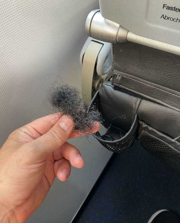 “We sterilize every flight” but apparently do not remove human hair from a cup holder do we JetBlue?