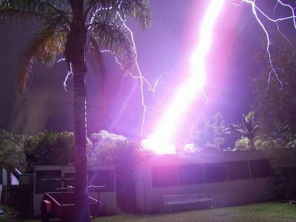 perfectly timed photos - huge lightning strike