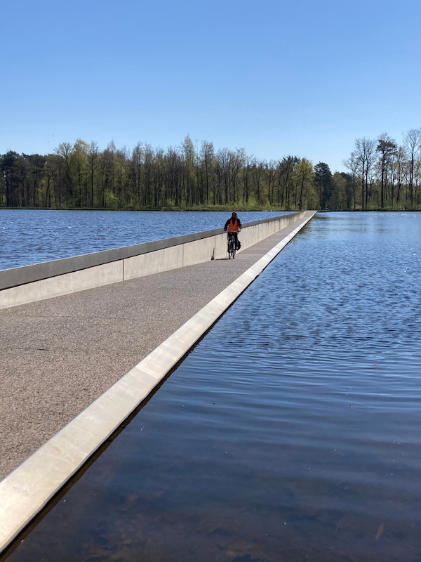 This path in Belgium lets you walk or cycle through a lake at eye-level.