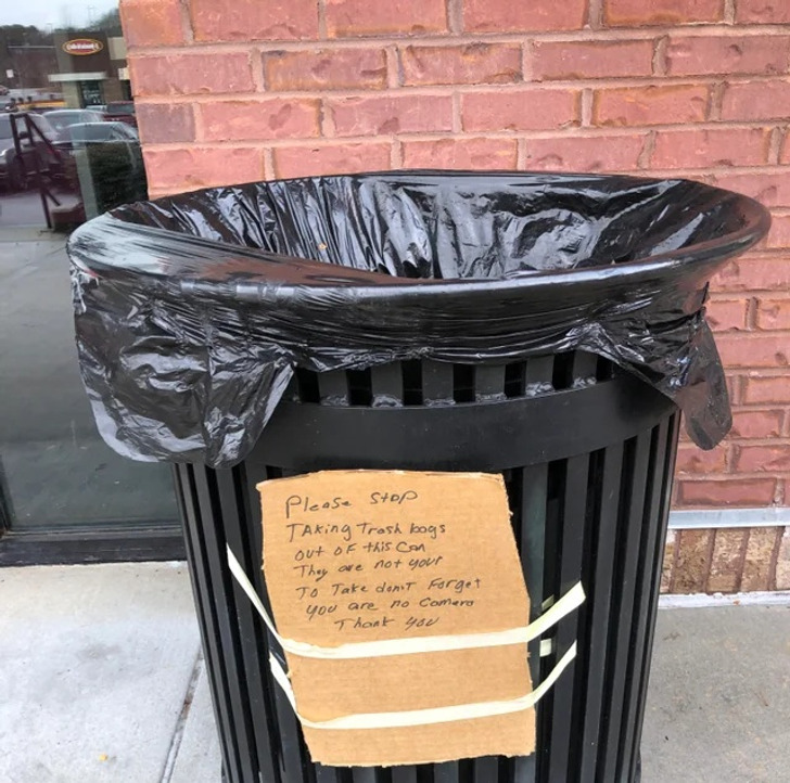 “The note says: Please stop taking trash bags out of this can, they are not yours to take, don’t forget you are on camera. Thank you.”