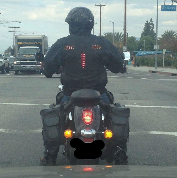 Whoever designed this biker jacket with signal lights is a pure genius.