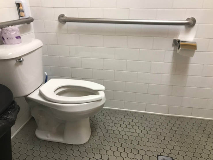 “This restaurant bathroom with the toilet paper holder just out of reach”