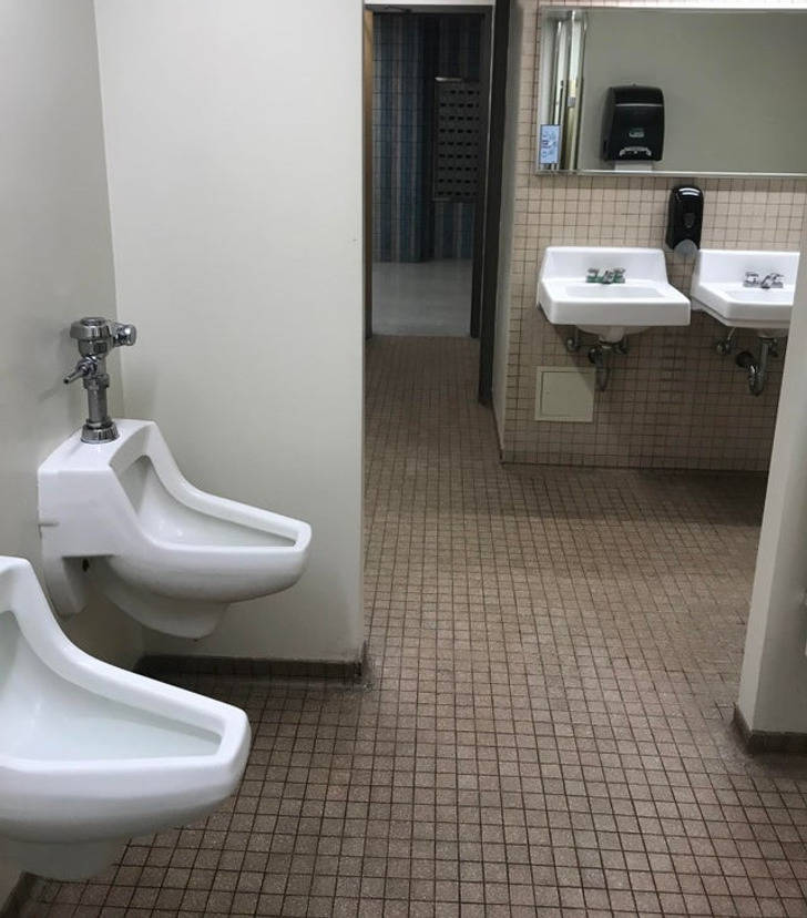 “I can see into the main hallway of the building standing at the urinal.”