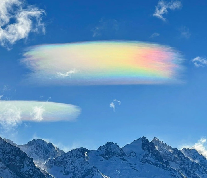 “A rainbow cloud that looks like a paint brush”