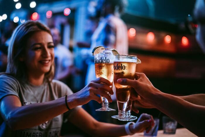 She showed up at the bar already so drunk that she could not walk without my assistance.

1. she drove herself there.

2. it was 2 in the afternoon.

3. she wanted to continue drinking as soon as we met there.