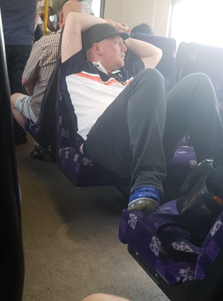 “This man taking up 5 seats on a train in England on possibly the hottest day the UK has seen”