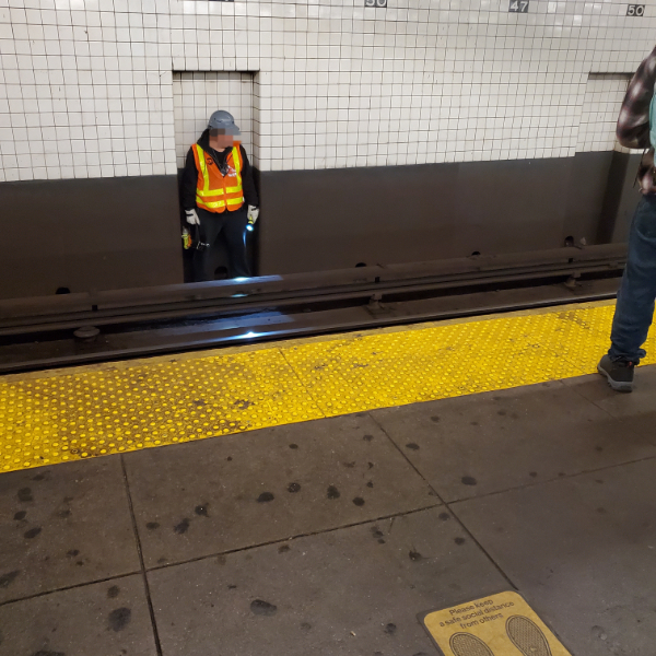 “A spot where an MTA (from NY) worker stands when a train is about to come.”
