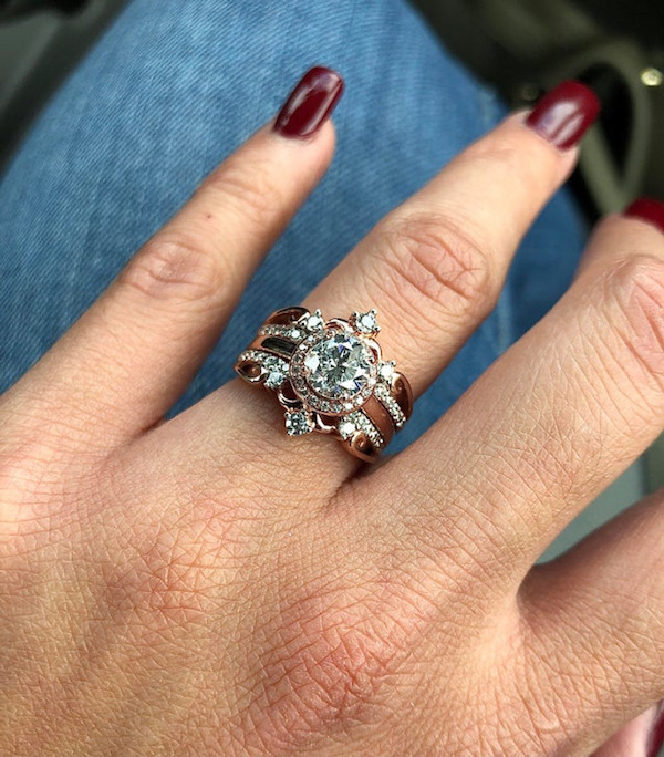 When we eloped, we were on a tight budget. After 2 years, my husband designed the most amazing wedding ring I have ever seen for me!