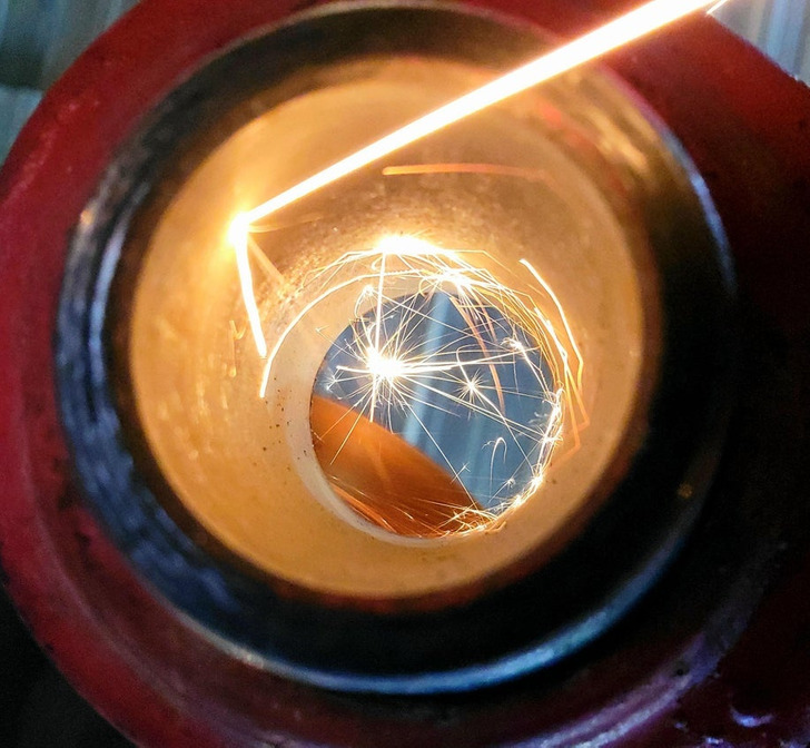 Weird and Wild Discoveries - Sparks bouncing down and around as I grind a hydraulic cylinder.