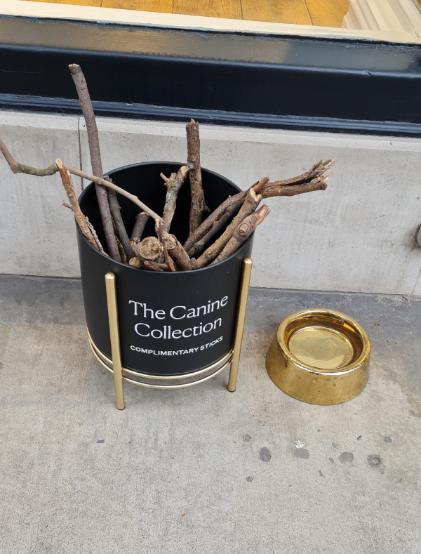 “Complimentary sticks” for dogs in a posh part of London.”