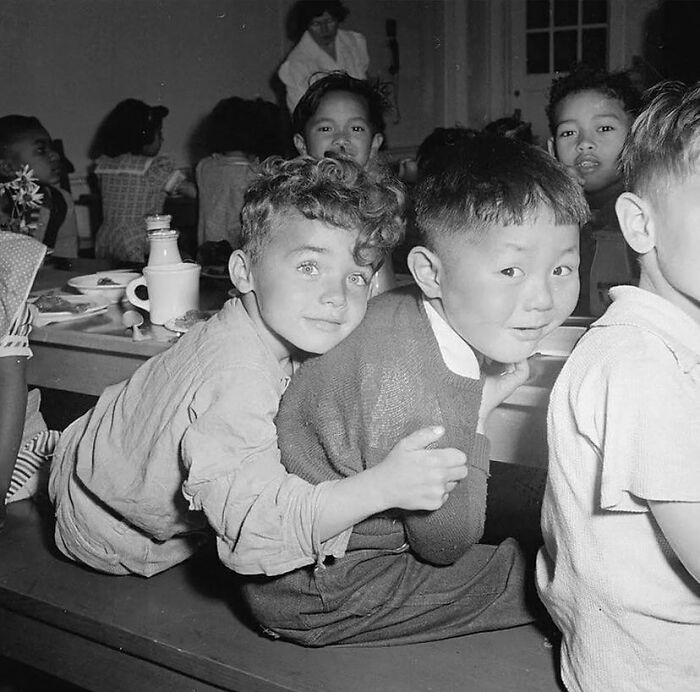 fascinating photos form history  - A Little Boy Hugging His Best Friend During Lunchtime