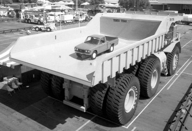 "A 1973 Terex 33-19 Titan dump truck with a pickup truck in the bed. It had a 169L V-16 diesel engine and weighed in at 1,209,500 lbs. (548 tons) and had a hauling capacity of 320 tons. It was never mass produced, but one of the prototypes was still in service until 1991"