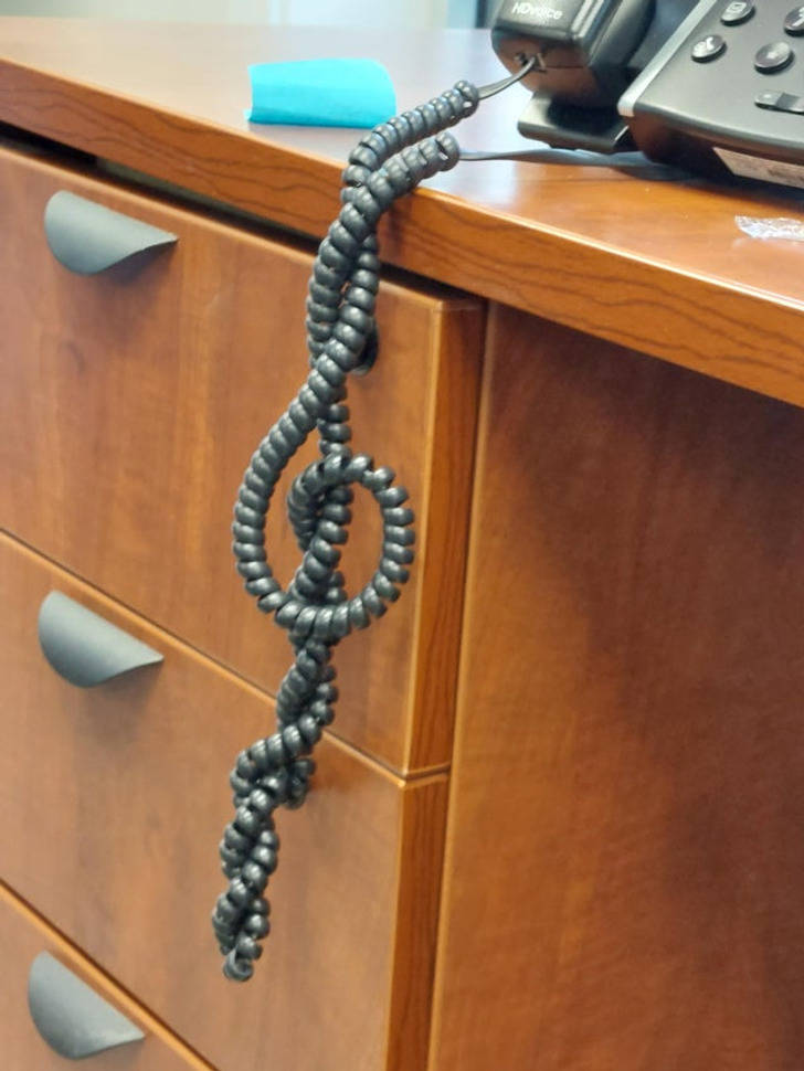 “My coworker’s phone cord made a treble clef.”