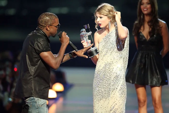 celebrity facts - Taylor Swift Has A Framed Picture Of Kanye West Interrupting Her At The 2009 MTV Video Music Awards In Her Living Room. It's Captioned,