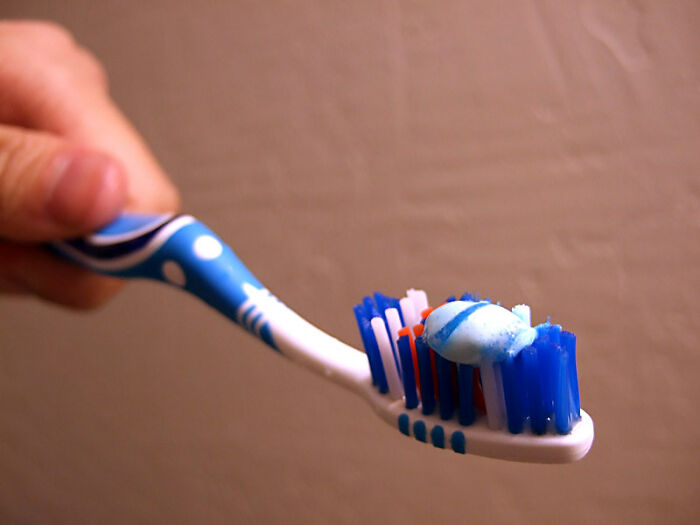 An entire curdle of toothpaste on your brush. You don't need that much. A pea-sized amount is enough.