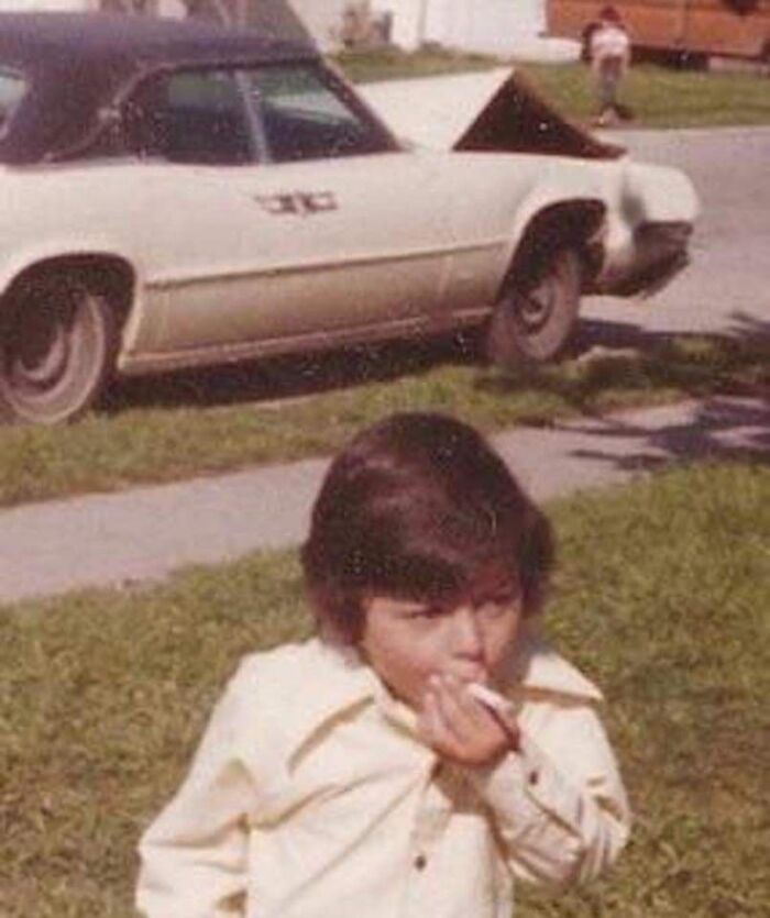 Historical photos - old photos - kid smoking crashed car