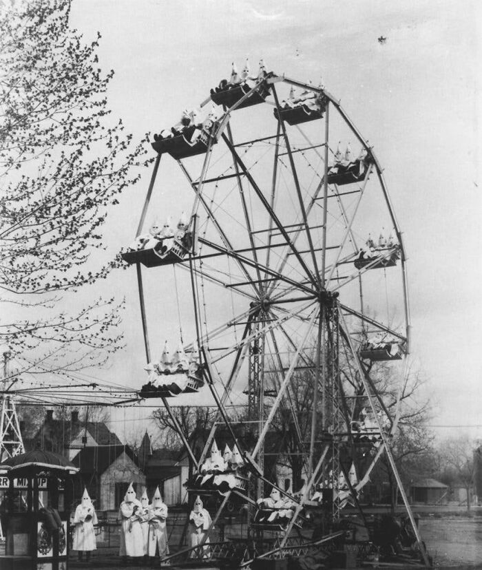 terrifying photos - These Pointy Hat Fellas Enjoying A Ferris Wheel Ride