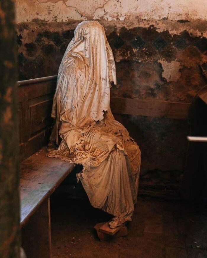 terrifying photos - Abandoned Church In A Small Czech Village Remains A Shrine Filled With Ghost Sculptures Of The Parishioners Who Passed Away There