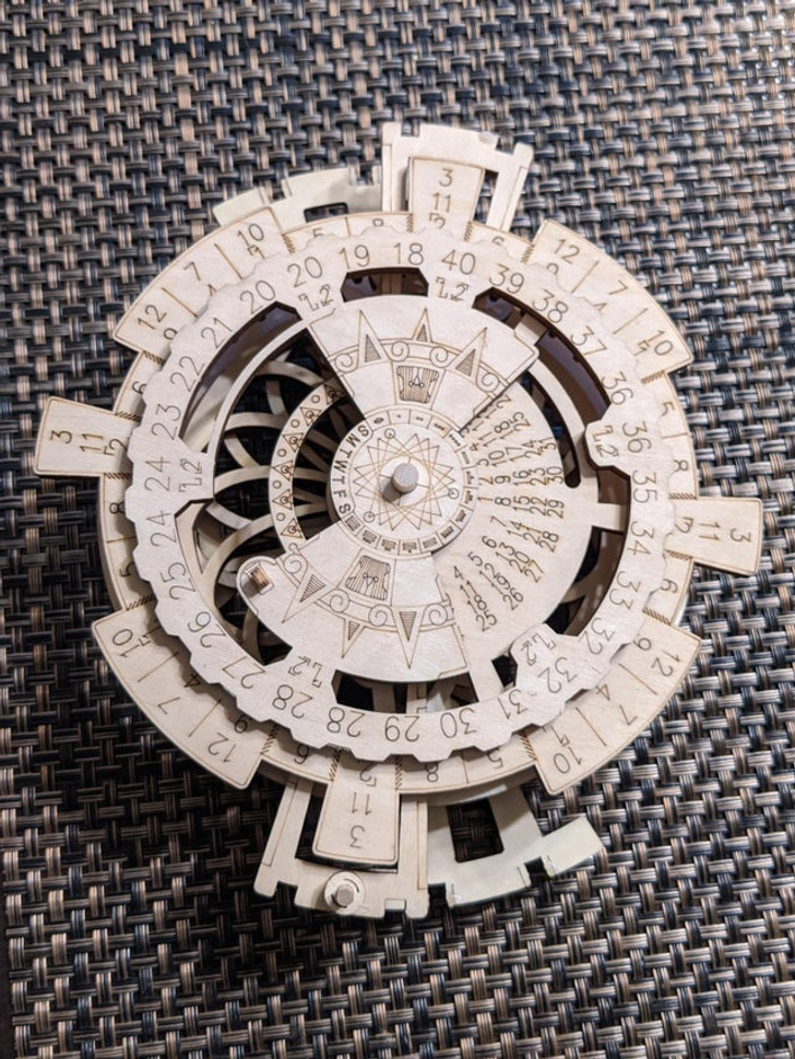 “About the size of my hand, found in the trash (I’m a trash man.)” Answer: “A laser-cut ’perpetual’ calendar.”