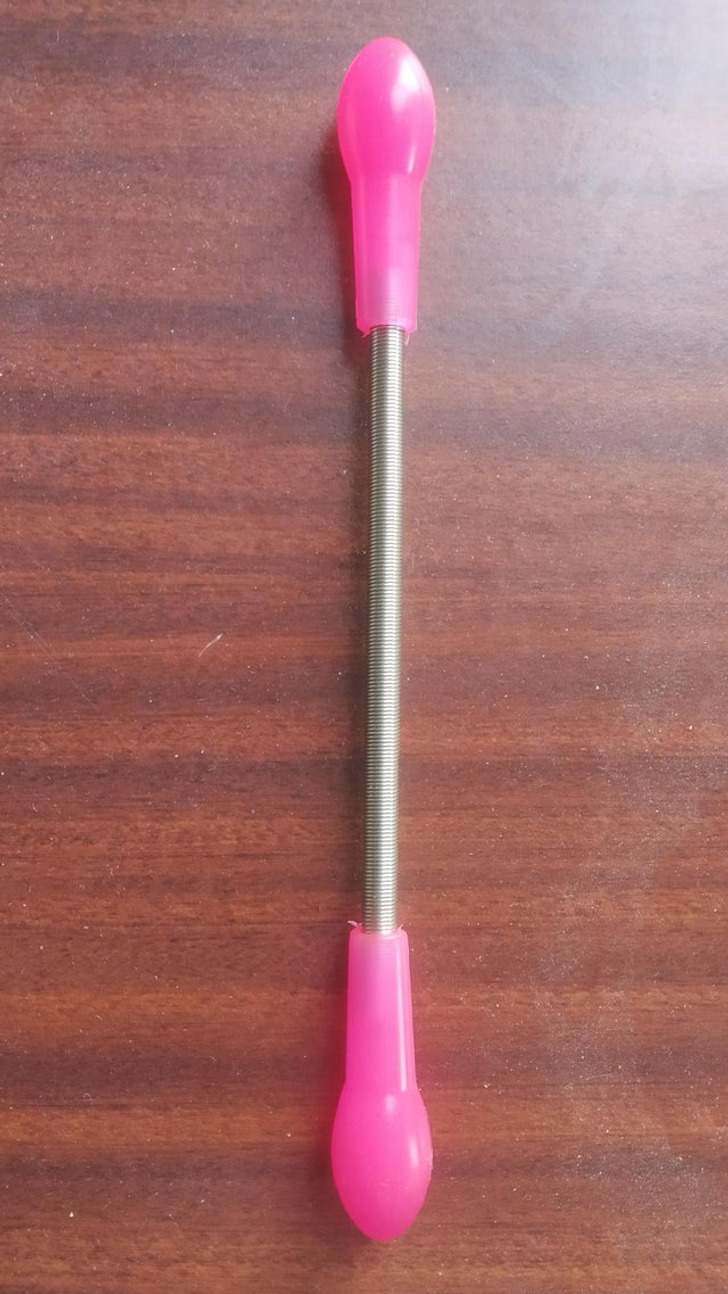 “Metal spring with plastic ends, 20 cm long, no writing or markings” Answer: “It’s a hair remover used for little hairs on one’s face.”