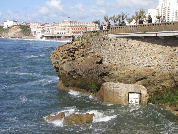 “A weird door I saw in the sea wall in Biarritz, France” Answer: “I would guess that it is a gate for storm water runoff that drains into the ocean.”