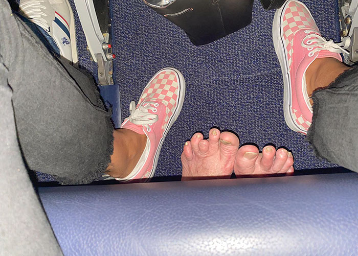 jerks - selfish people - troll feet on airplane