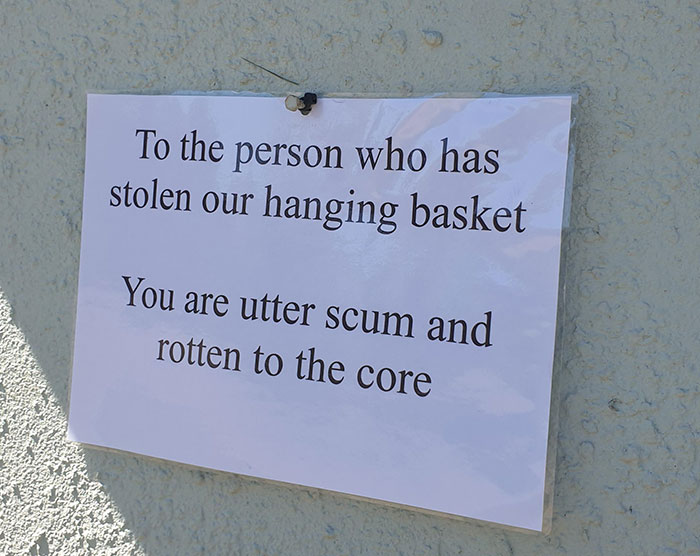 jerks - selfish people - sign - To the person who has stolen our hanging basket You are utter scum and rotten to the core