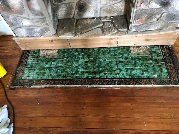 I previously posted about uncovering Victorian tile under a faux (and poorly built) fireplace in my 1880 home. Here’s what we found after completely removing the bottom portion – hoping to find the same along the wall when the rest is removed