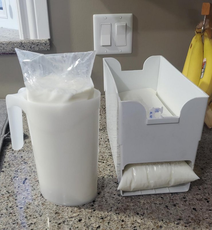 fascinating photos - In some parts of Canada, milk is bought in bags. 3 bags are packaged in 1 bag totalling 4L(~1gallon). A plastic jug holds the bag while the corner is cut to pour out. An organizer stacks the bag with a slit for the milk date tag.