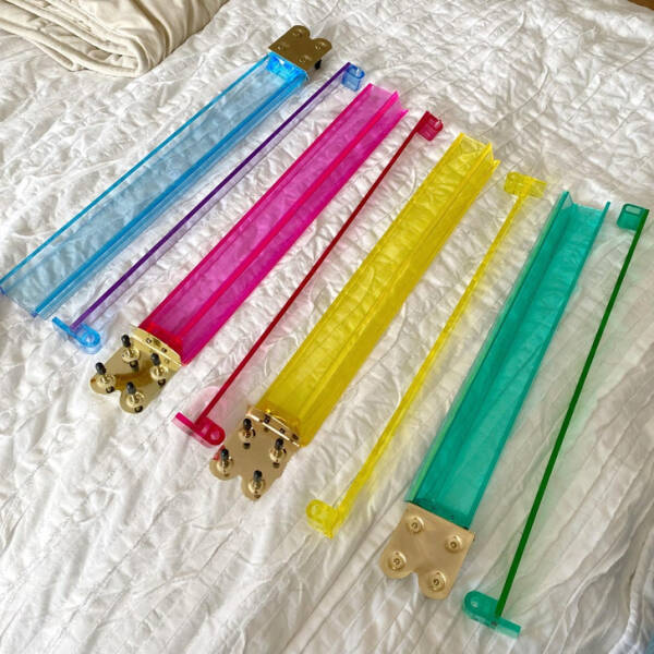 “I now own these neon rainbow acrylic mystery sticks I found in the Goodwill bins. Anyone know what I bought?”

Answer: "They are colorful mahjong racks."
