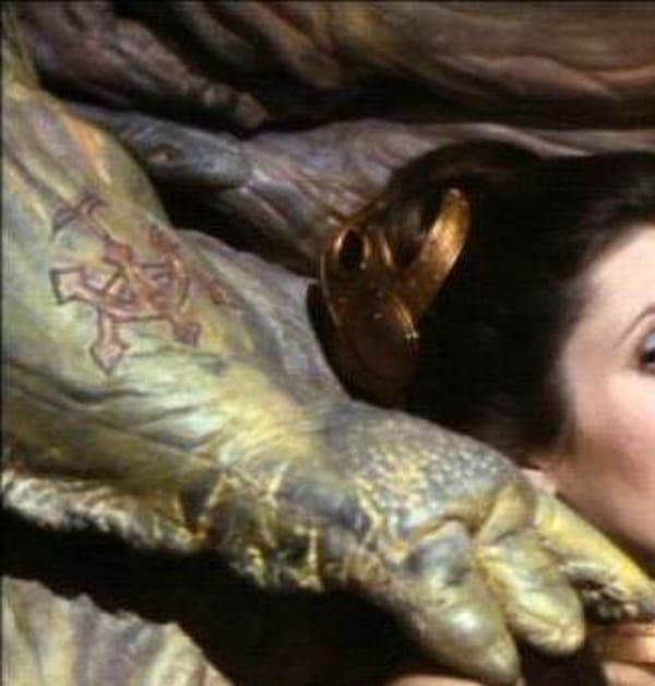 Movie facts  - In Star Wars: Episode VI – Return of the Jedi (1983) Jabba the Hutt has a tattoo on his right forearm.