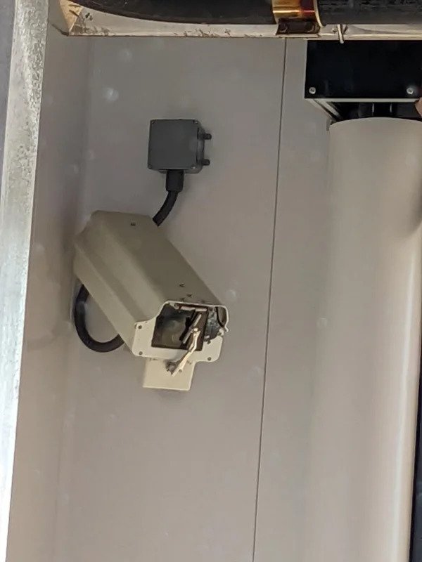 “Security Camera inside the car wash is equipped with a squeegee wiper.”