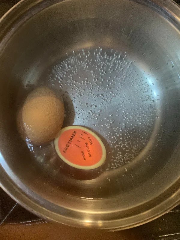 “An egg timer that shows you how hard your egg is by cooking it with the egg.”