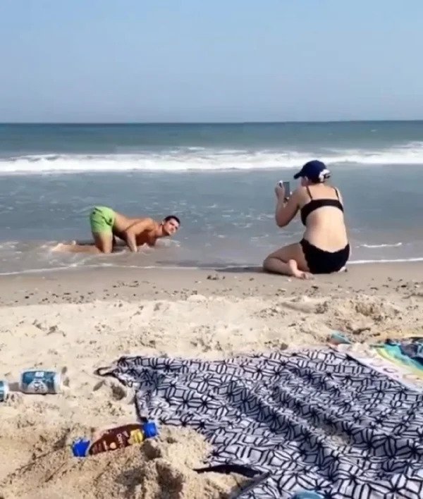 Influencers taking absurd pics - beach -