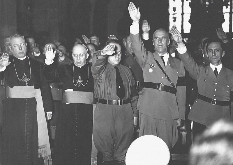 pics from history - Joseph Goebbels with Catholic clergy giving Nazi salute. Germany. 1930’s.