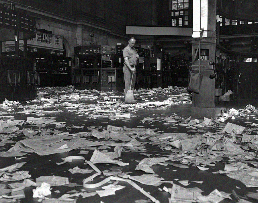 A janitor sweeps the floor of the New York Stock Exchange following the Wall Street Crash of 1929