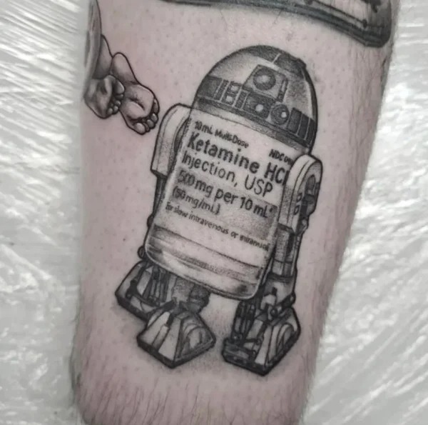 Cringe Tattoos - arm r2d2 tattoo