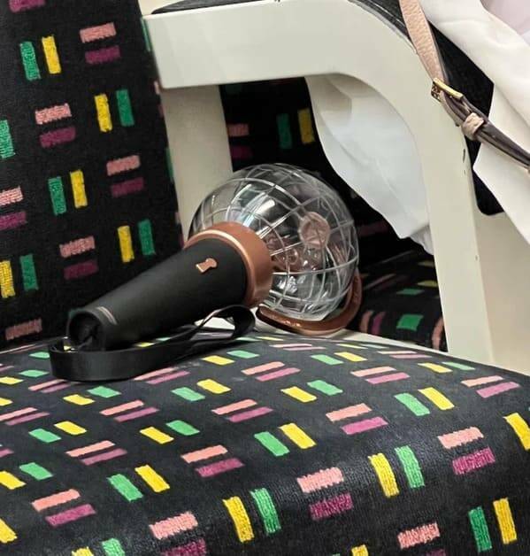 "Microphone-shaped object with a transparent globe that was spotted on the London underground. What is it?"
<br/><br/>
"That’s a light stick for the kpop group ateez. They had a concert tonight. Whoever lost that is going to be very sad."
