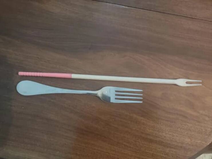 "Long wooden implement with two tines, not sharp at all (probably not a pot fork) – the fork is for scale."
<br/><br/>
"It’s a cooking chopstick that is missing its spoon mate. I have a pair and can find them on Amazon by searching Tokyo design studio cooking chopsticks."