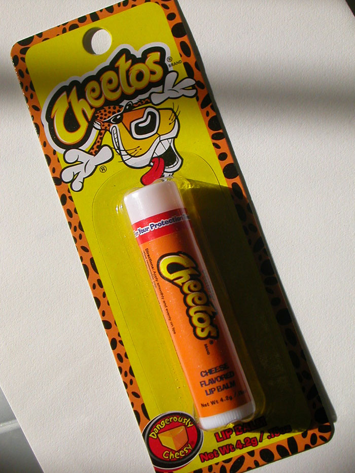 brand fails and disasters - cheetos lip balm - Brand Cheetos Your Protection Direc Mon Apply smoothly and evenly on lips Cheetos Cheese Flavored Lip Balm Net Wt 4.2g Lip Balm Net Wt 4.2g Cheesy