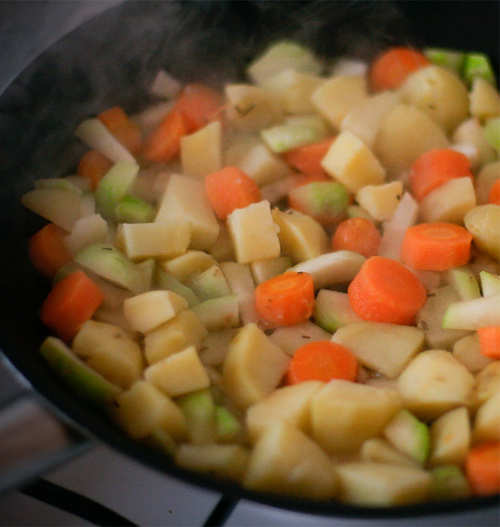 No matter what you're pan frying, don't crowd the pan. Get a bigger pan or cook them in batches, but the reason your potatoes and veggies aren't getting brown and crisp is because they're drowning in their own juice!