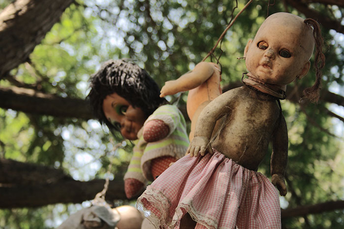 There is a island of the dolls in Mexico City that has thousands of creepy dolls to honor a little girl who drowned in the 1950s. The island is also one of the most haunted places.