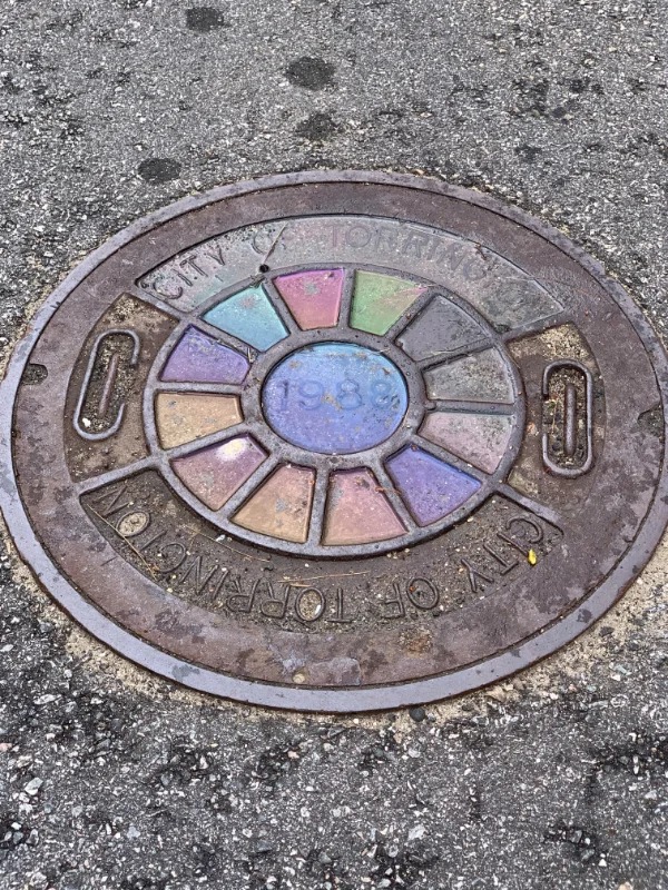 “The design of this manhole cover separated the colors of the oily water.”