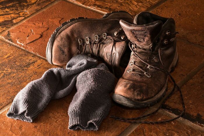 One thing on Reddit I read was that having a pair of large work boots on the porch next to the door can deter burglars (unless they know you). It basically says "Someone is home right now, it its possibly a big dude who can hurt you."