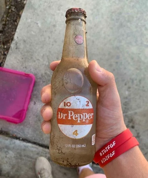 Original Dr Pepper that was buried in the garden, the soda turned clear.