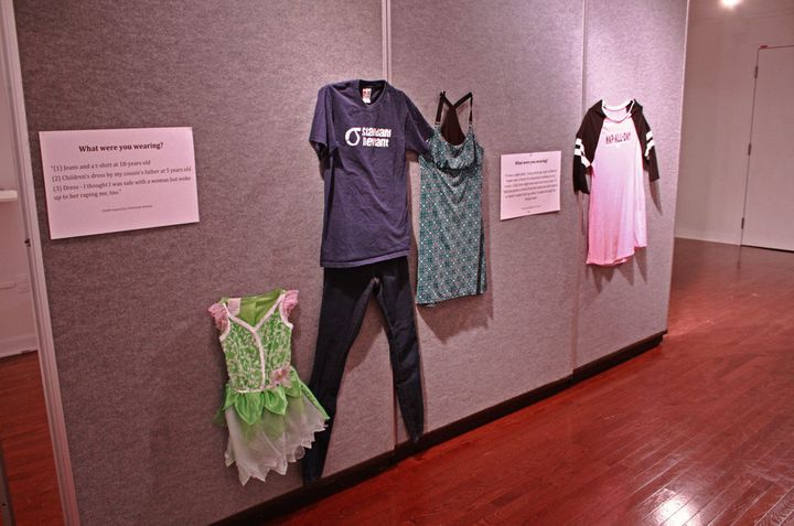 A museum display showing the clothing worn by sexual assault survivors during the time of their attacks